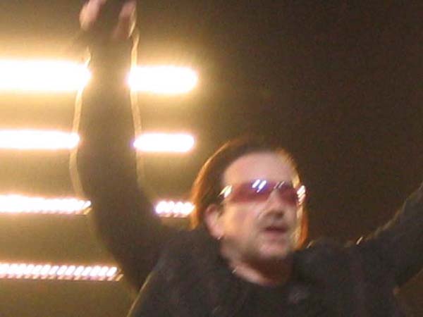 Bono blurry hands up