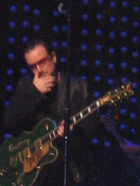 Bono rubbing nose